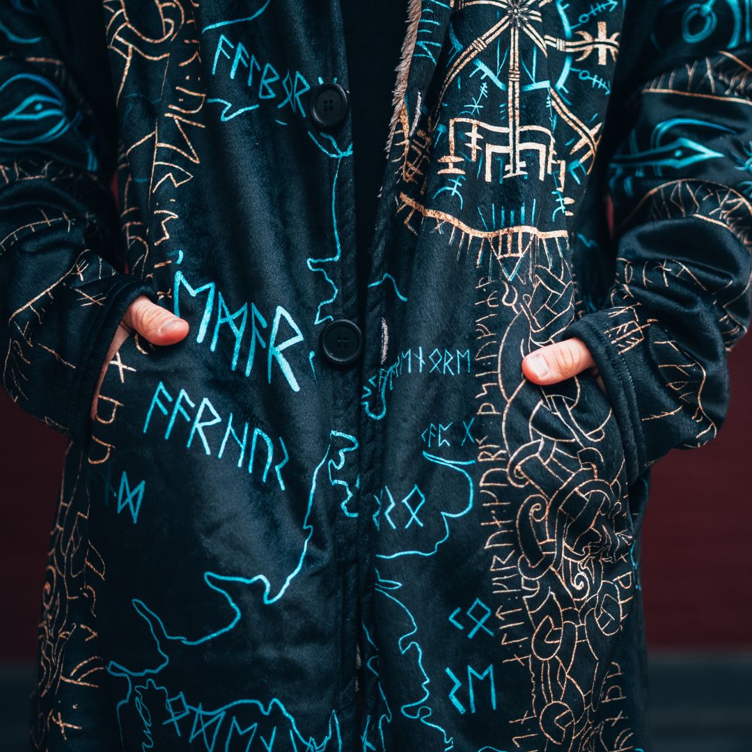 Close-up of the cloak's buttons, sherpa-lined pockets and stitching